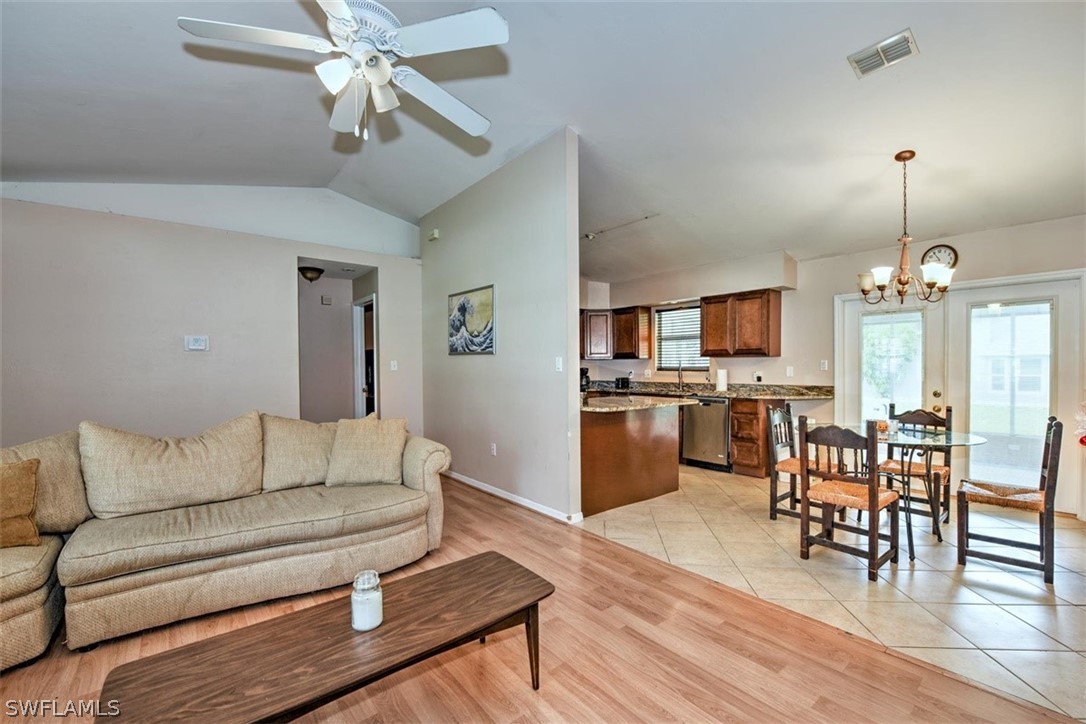 19004 Tangerine Road Fort Myers, FL 33967 - Photo 8 of 26 a living room with furniture kitchen view and a wooden floor