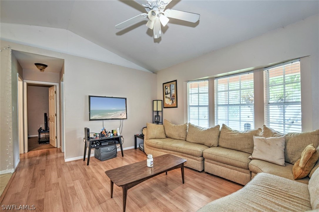 19004 Tangerine Road Fort Myers, FL 33967 - Photo 9 of 26 a living room with furniture and a large window