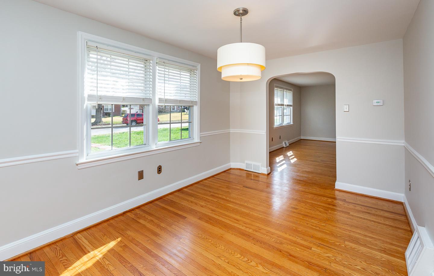 222 Pickwick Road Havertown, PA 19083 - Photo 11 of 39 a view of empty room with wooden floor and fan