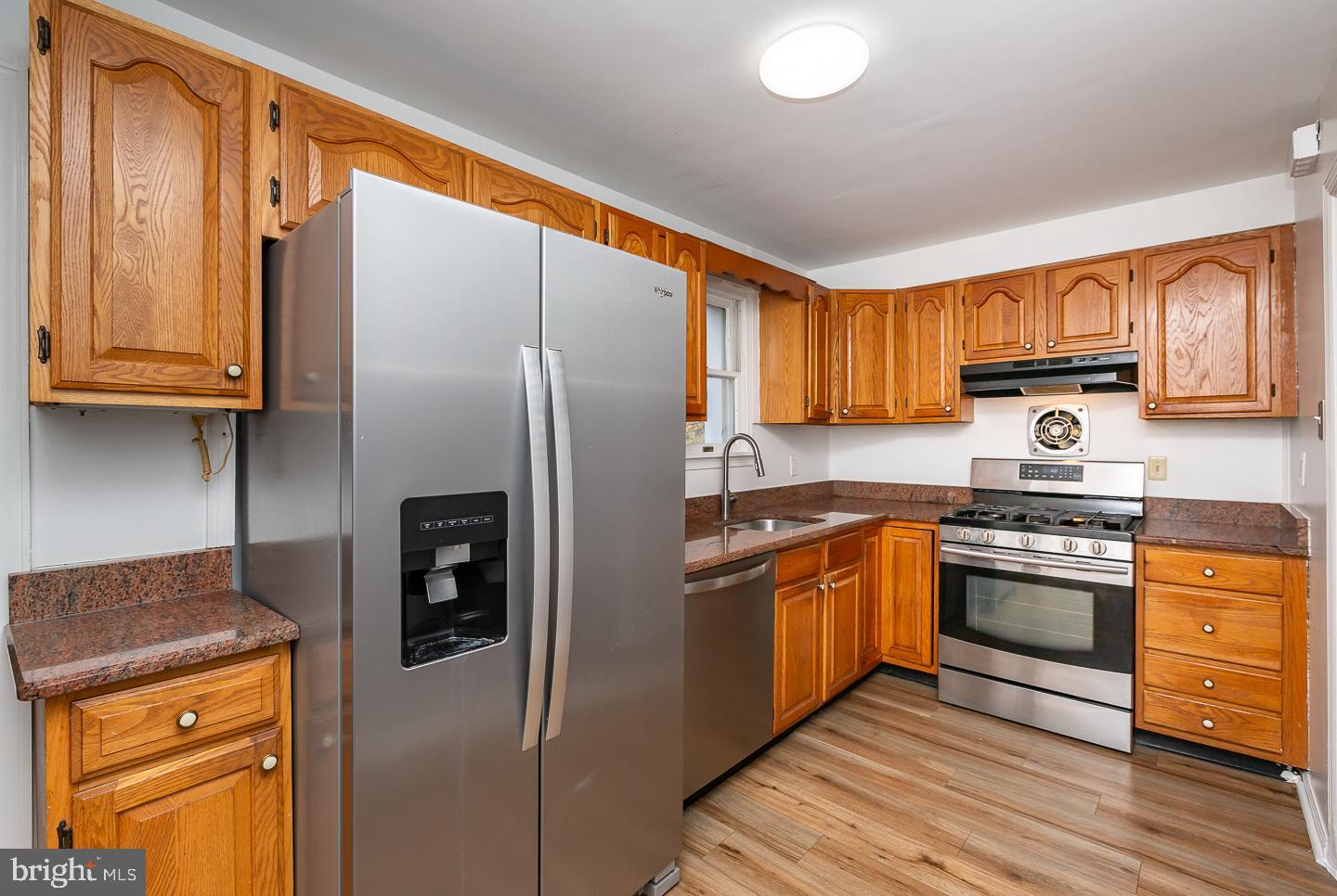 222 Pickwick Road Havertown, PA 19083 - Photo 13 of 39 a kitchen with stainless steel appliances granite countertop a refrigerator stove and sink