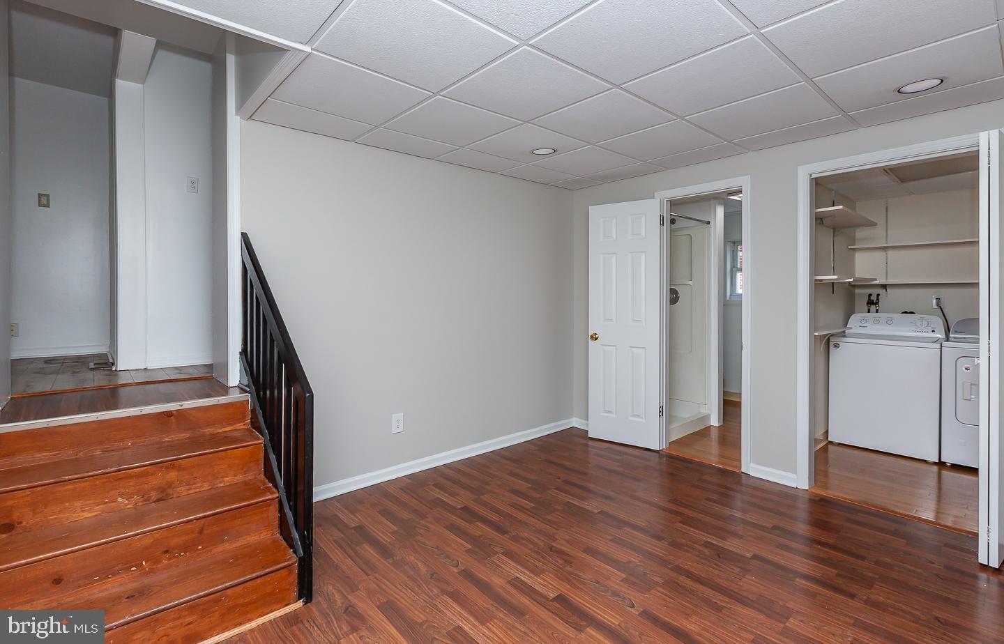 222 Pickwick Road Havertown, PA 19083 - Photo 16 of 39 a view of empty room with wooden floor and stairs