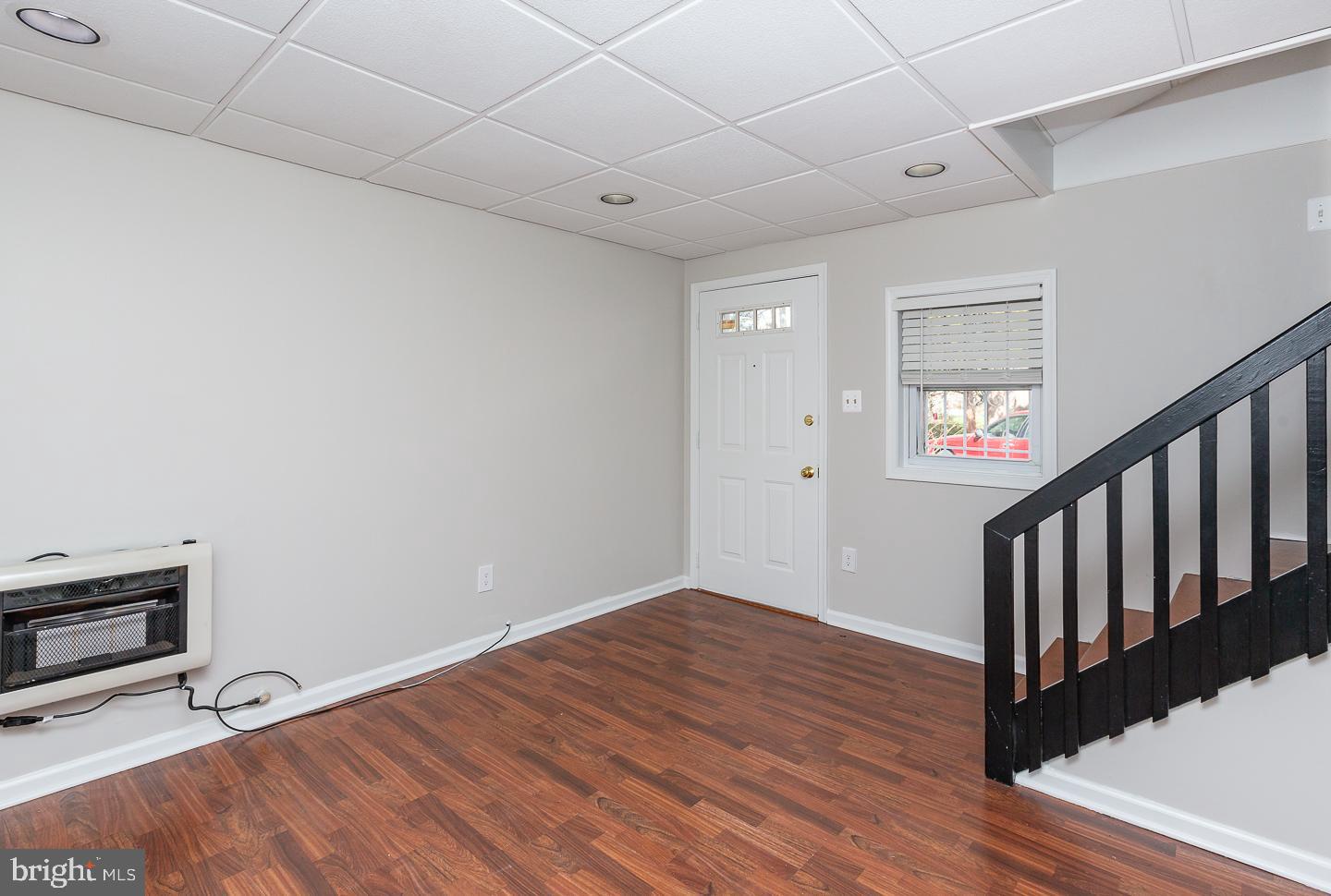 222 Pickwick Road Havertown, PA 19083 - Photo 18 of 39 a view of an empty room with wooden floor and a window