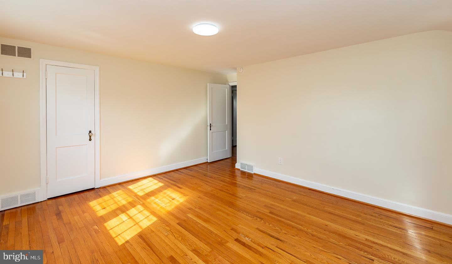 222 Pickwick Road Havertown, PA 19083 - Photo 24 of 39 a view of empty room with wooden floor