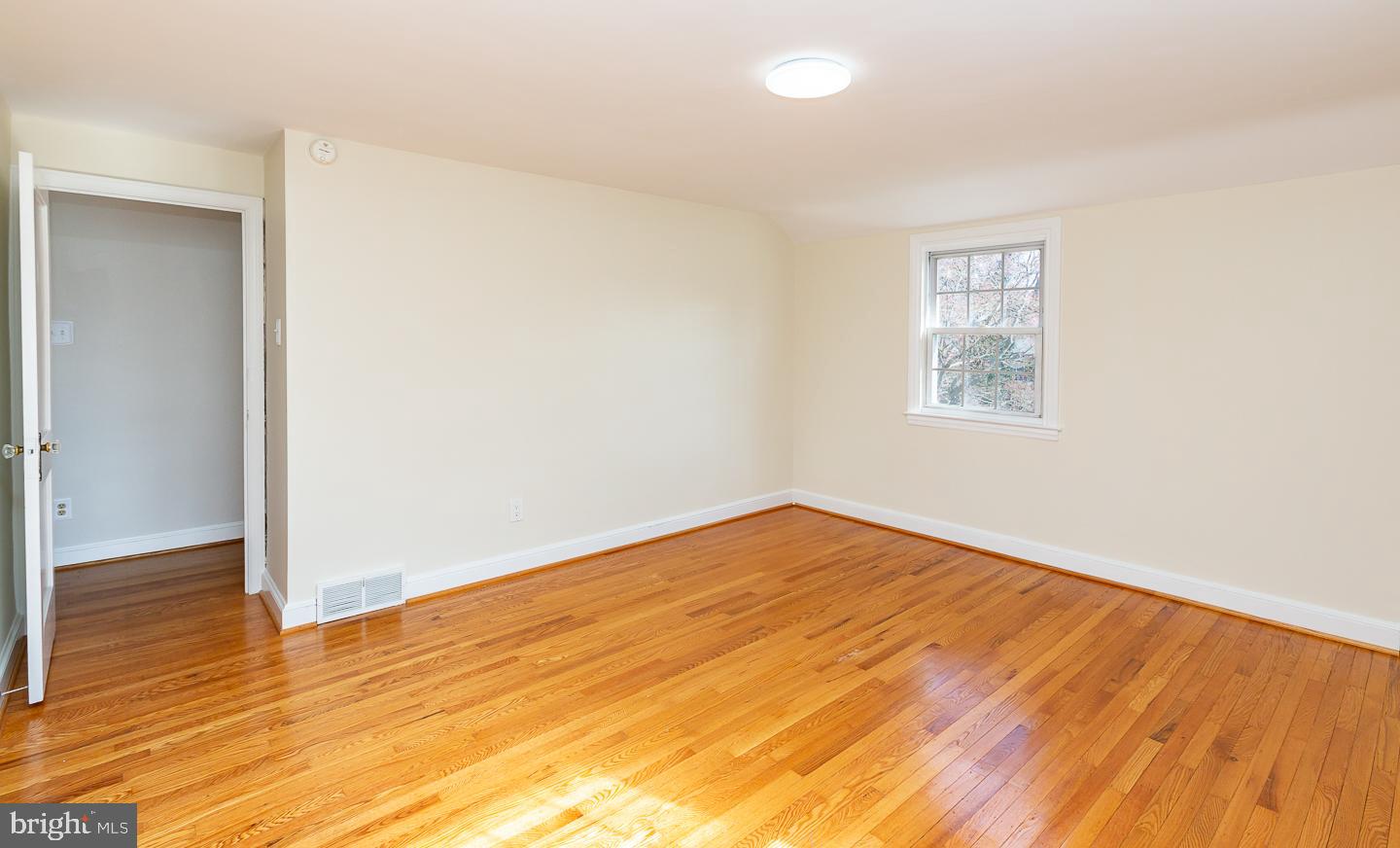 222 Pickwick Road Havertown, PA 19083 - Photo 25 of 39 an empty room with wooden floor and windows