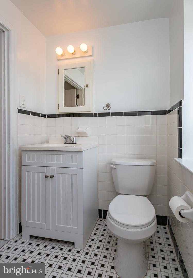 222 Pickwick Road Havertown, PA 19083 - Photo 27 of 39 a bathroom with a sink a toilet a mirror and shower
