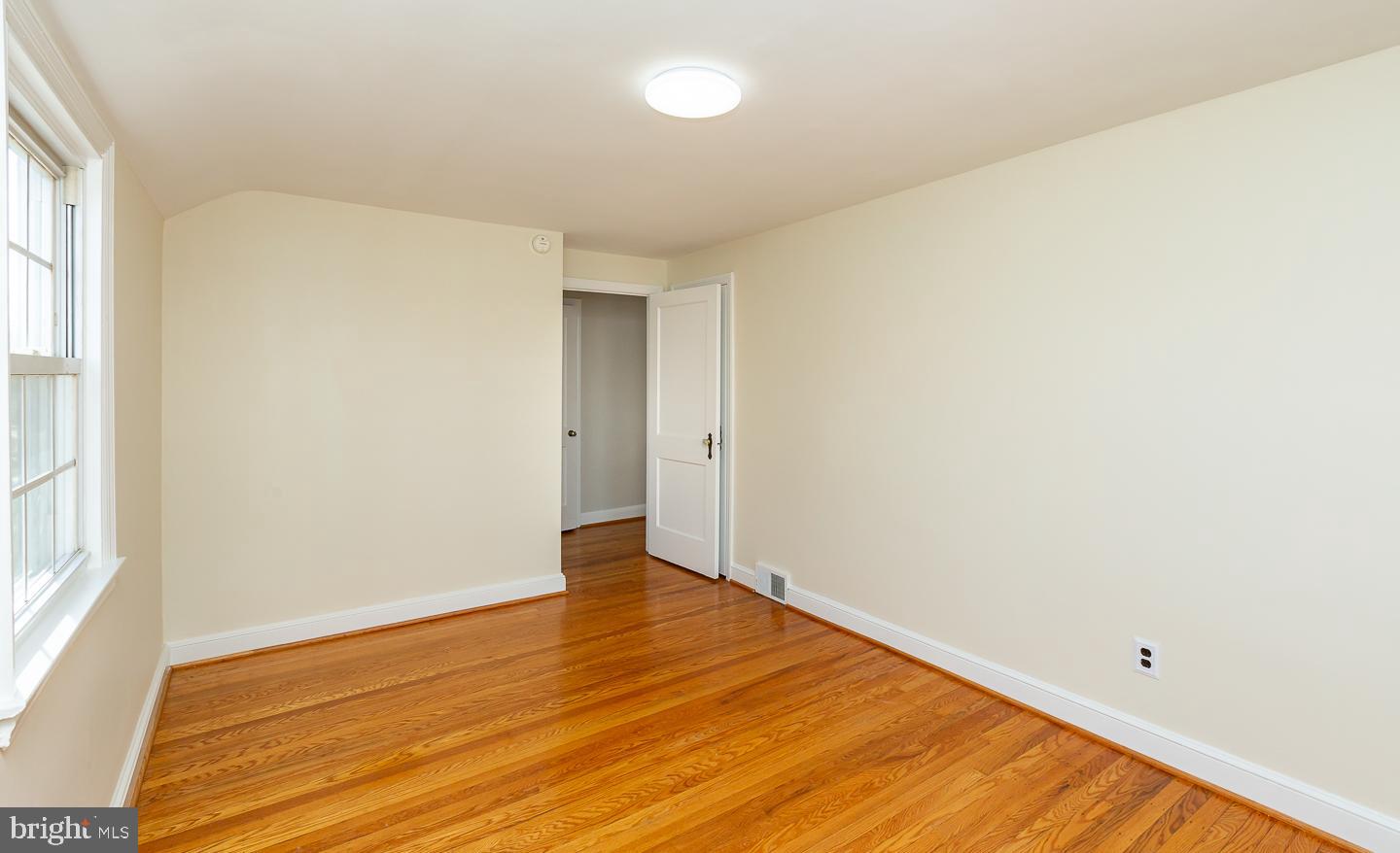222 Pickwick Road Havertown, PA 19083 - Photo 30 of 39 an empty room with wooden floor and windows