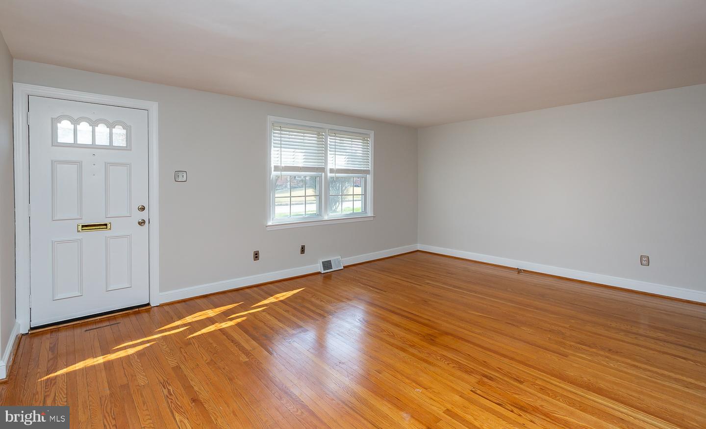 222 Pickwick Road Havertown, PA 19083 - Photo 7 of 39 a view of empty room with wooden floor and fan