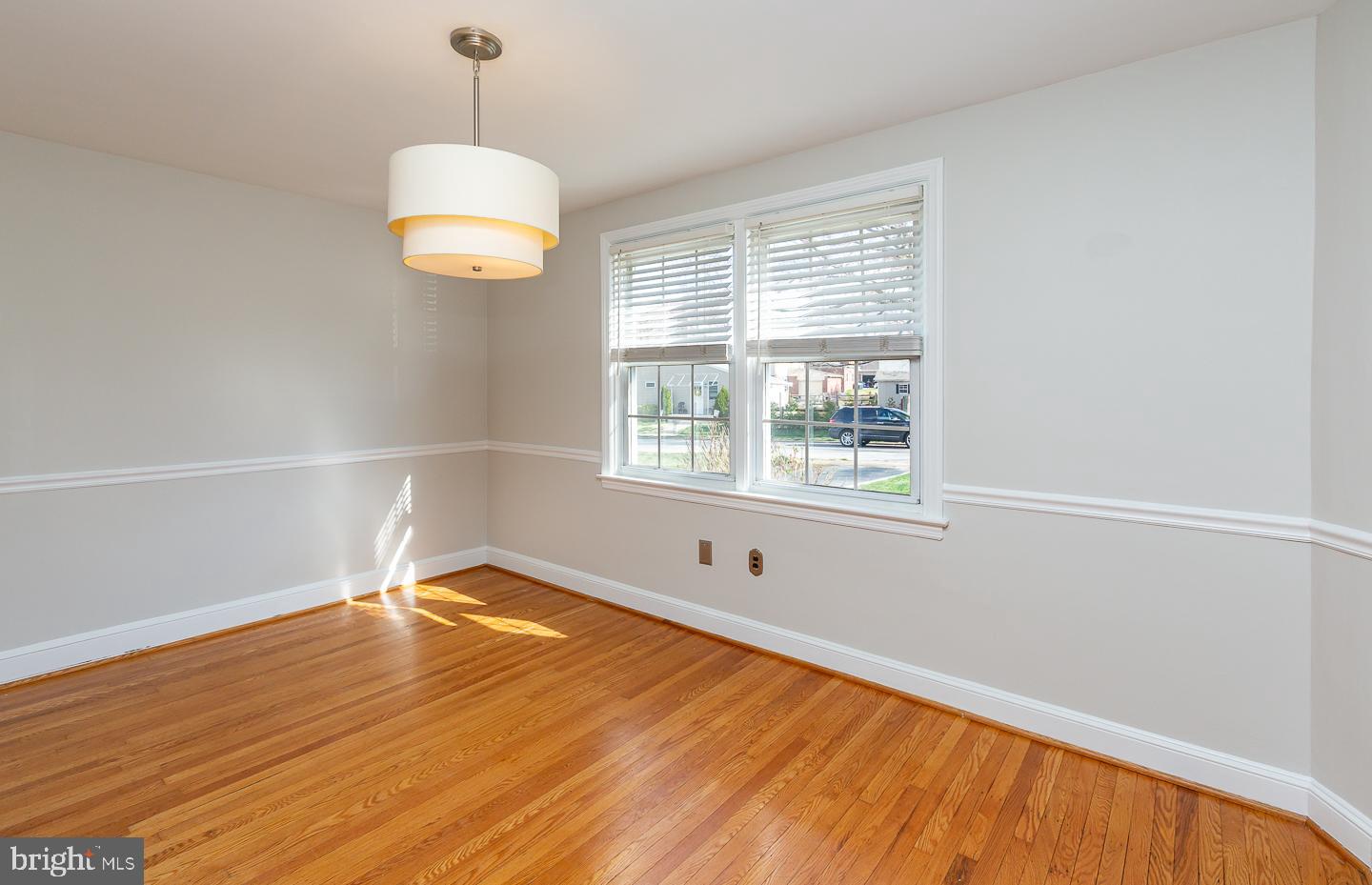222 Pickwick Road Havertown, PA 19083 - Photo 10 of 39 a view of an empty room with wooden floor and a window