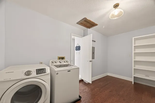 a view of storage and utility room with a washer dryer