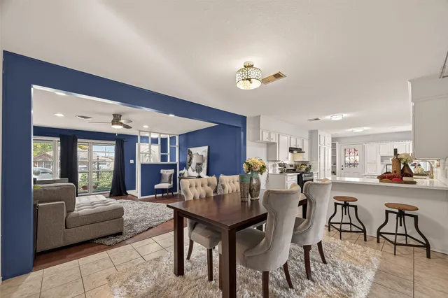 a view of a dining room with furniture window and outside view