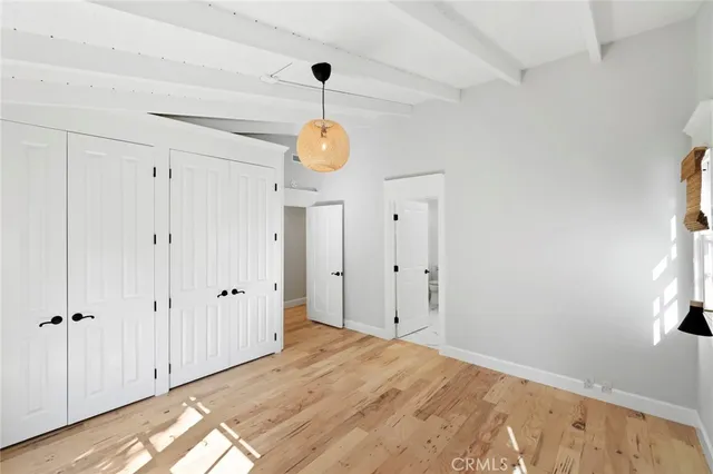 a view of a livingroom with wooden floor