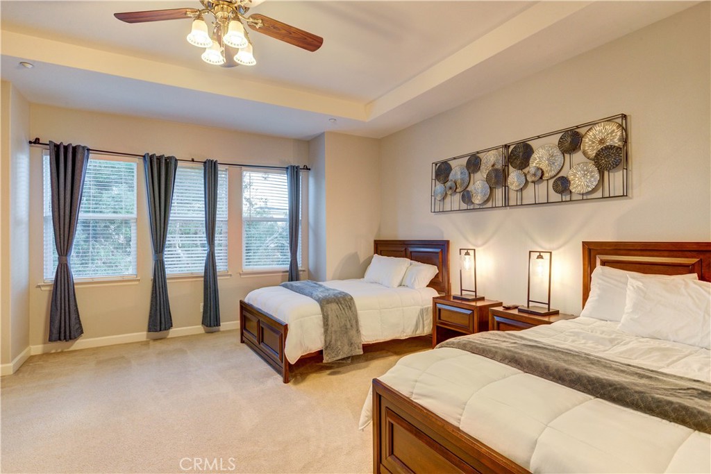 1941 Devaul Ranch Drive San Luis Obispo, CA 93405 - Photo 36 of 58 a spacious bedroom with two large bed and a large window