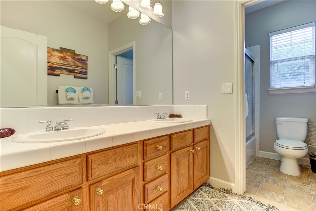 1941 Devaul Ranch Drive San Luis Obispo, CA 93405 - Photo 37 of 58 a bathroom with a sink and a toilet