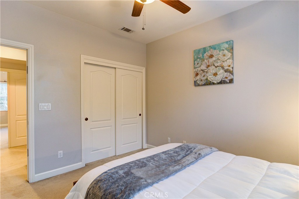 1941 Devaul Ranch Drive San Luis Obispo, CA 93405 - Photo 39 of 58 a bedroom with a bed and a painting on the wall