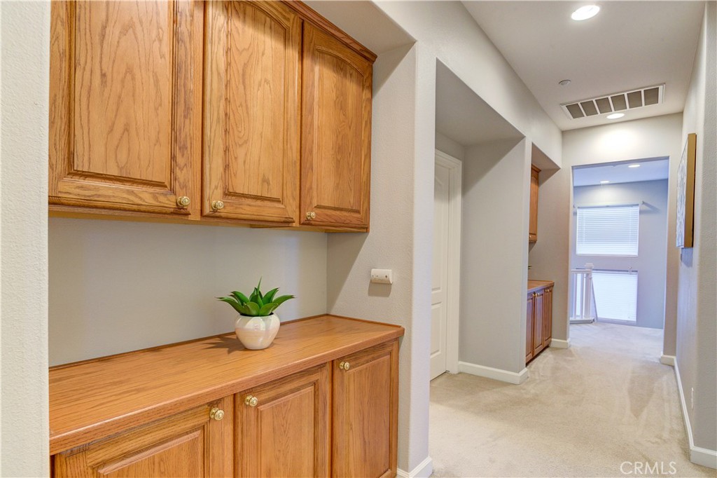 1941 Devaul Ranch Drive San Luis Obispo, CA 93405 - Photo 43 of 58 a kitchen with stainless steel appliances granite countertop cabinets and a potted plant