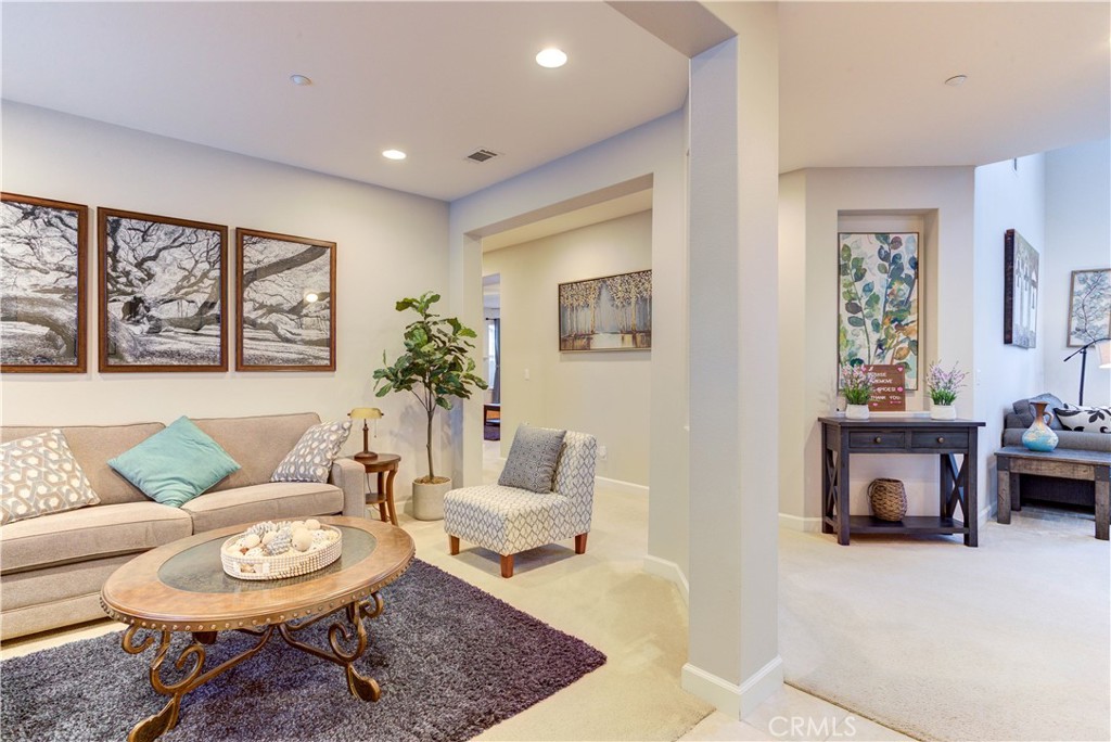 1941 Devaul Ranch Drive San Luis Obispo, CA 93405 - Photo 47 of 58 a living room with furniture a rug and a fireplace