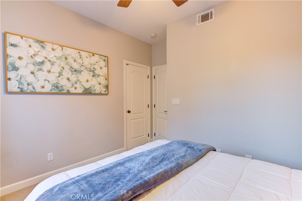 1941 Devaul Ranch Drive San Luis Obispo, CA 93405 - Photo 48 of 58 a bedroom with a bed and wall painting