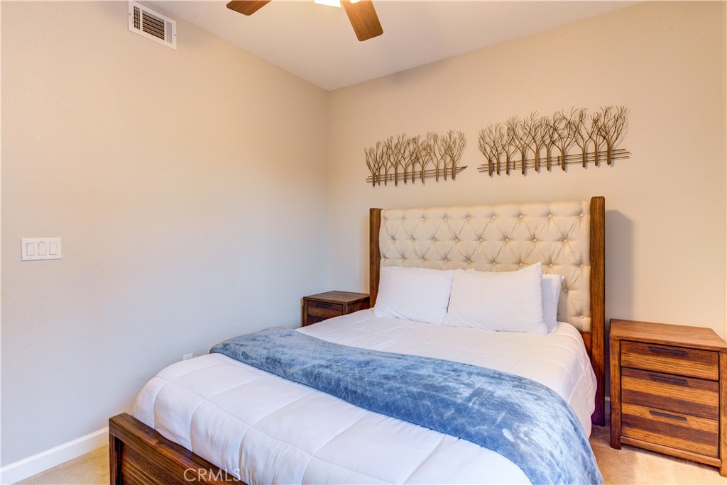 1941 Devaul Ranch Drive San Luis Obispo, CA 93405 - Photo 49 of 58 a bedroom with a bed and a painting on the wall