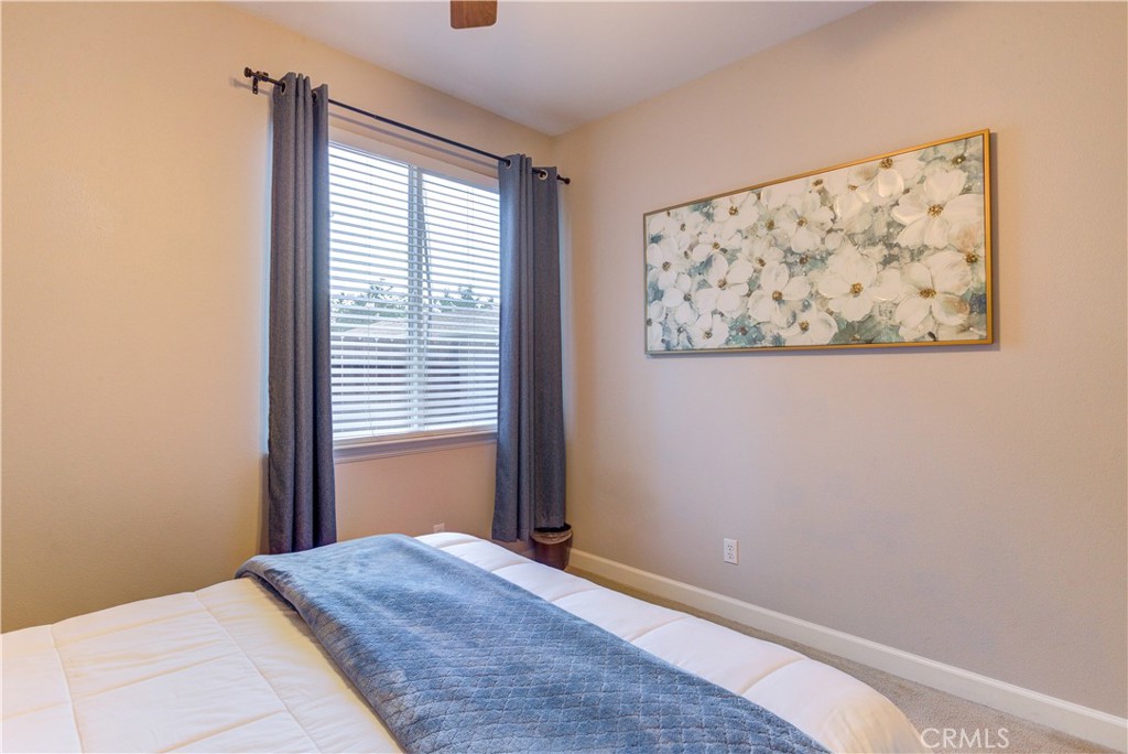 1941 Devaul Ranch Drive San Luis Obispo, CA 93405 - Photo 51 of 58 a bedroom with a bed and a window