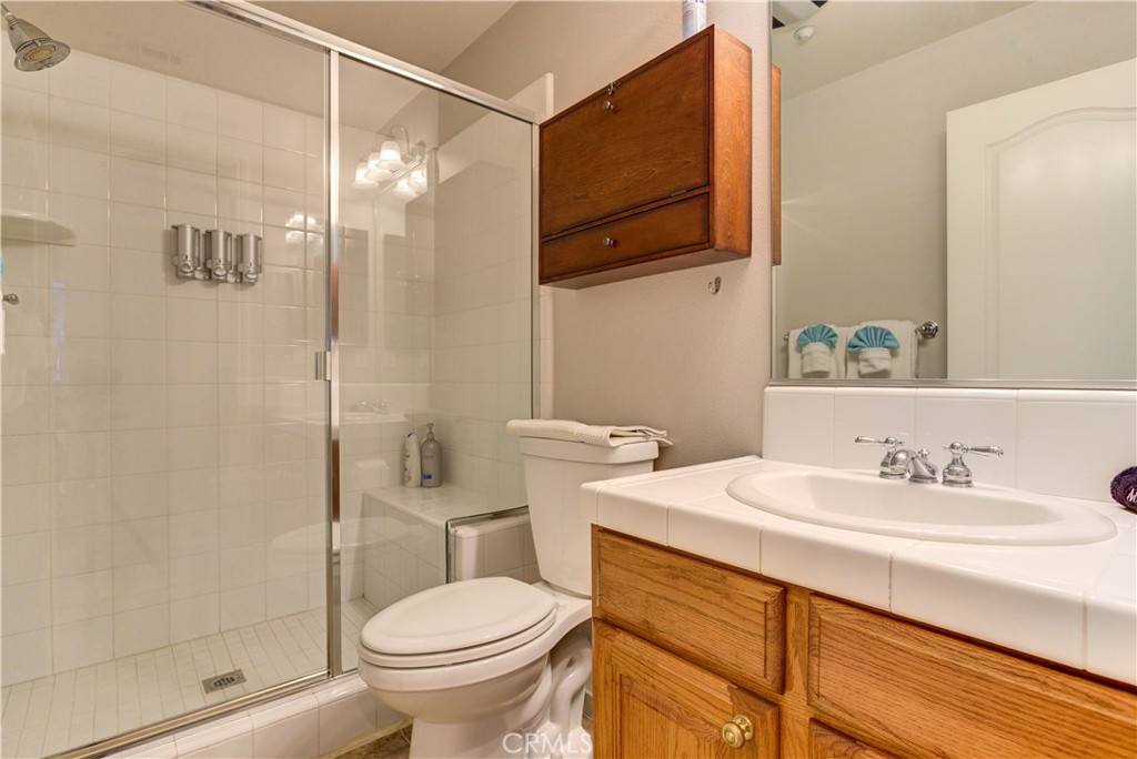 1941 Devaul Ranch Drive San Luis Obispo, CA 93405 - Photo 53 of 58 a bathroom with a sink toilet and shower