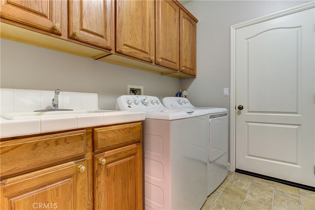 1941 Devaul Ranch Drive San Luis Obispo, CA 93405 - Photo 54 of 58 a utility room with cabinets