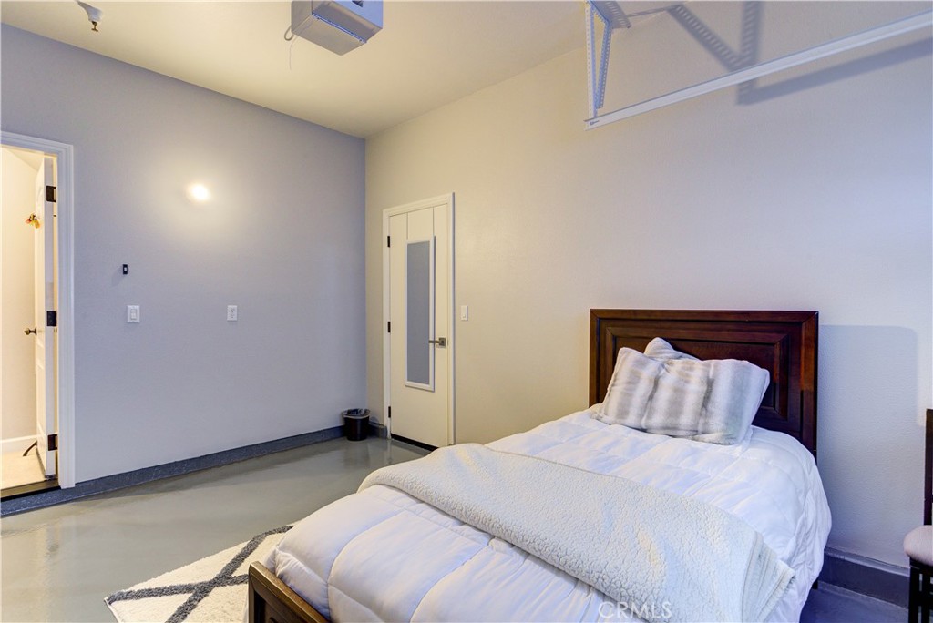 1941 Devaul Ranch Drive San Luis Obispo, CA 93405 - Photo 56 of 58 a bedroom with a bed and a ceiling fan