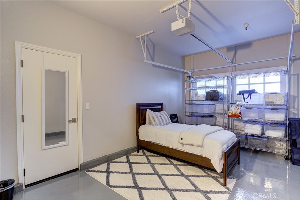 1941 Devaul Ranch Drive San Luis Obispo, CA 93405 - Photo 57 of 58 a bedroom with a bed and large window