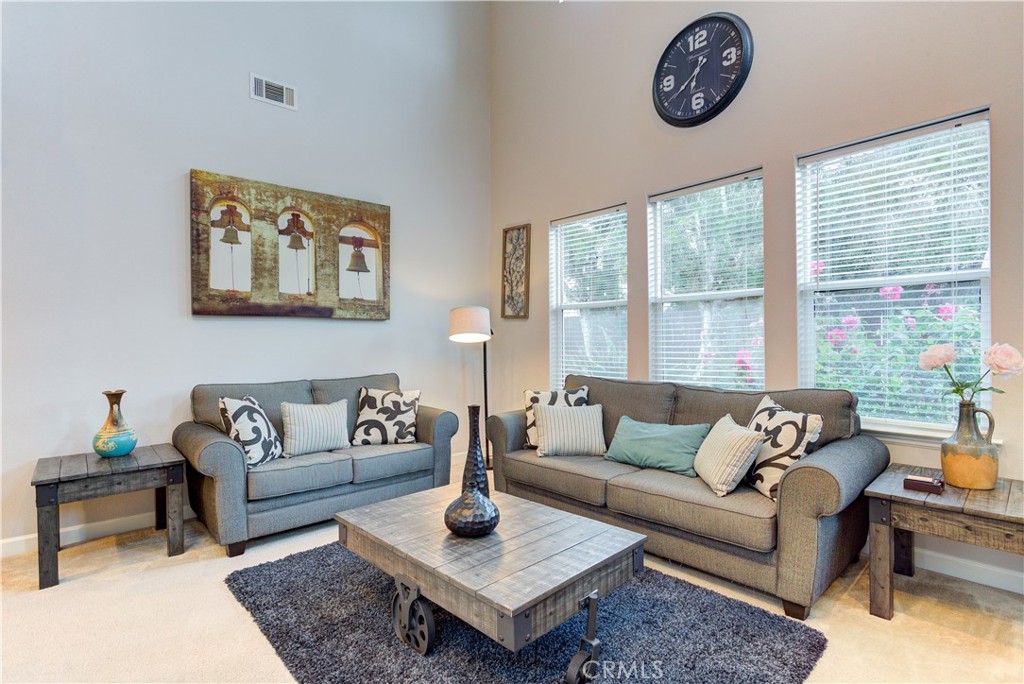1941 Devaul Ranch Drive San Luis Obispo, CA 93405 - Photo 6 of 58 a living room with furniture a rug and a large window