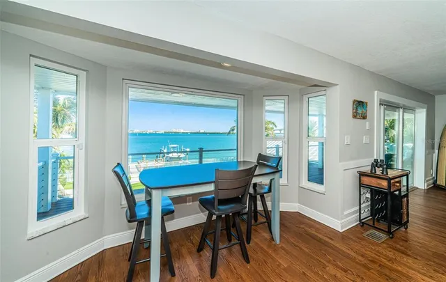 a front view of a house with porch and outdoor seating