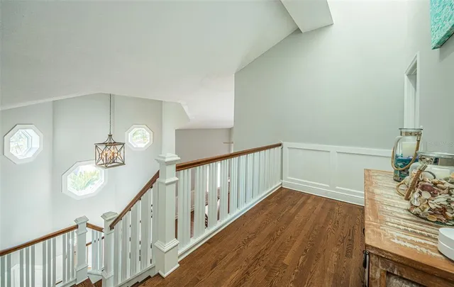 a view of swimming pool with lounge chair and dinning table under an umbrella
