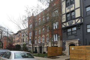 a view of a building with a street