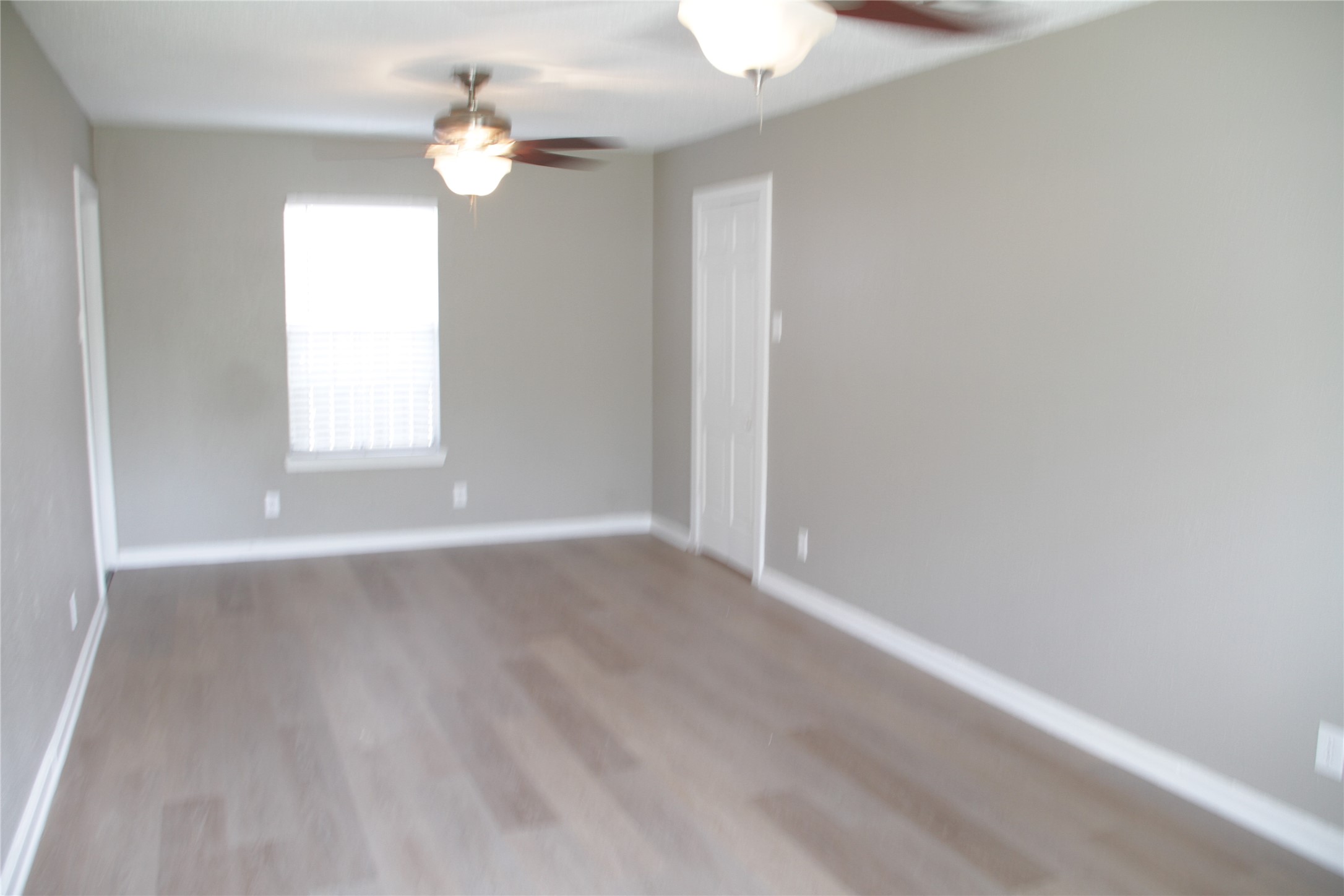 5400 Sheldon Street, Unit B Houston, TX 77008 - Photo 5 of 20 wooden floor in an empty room with a window