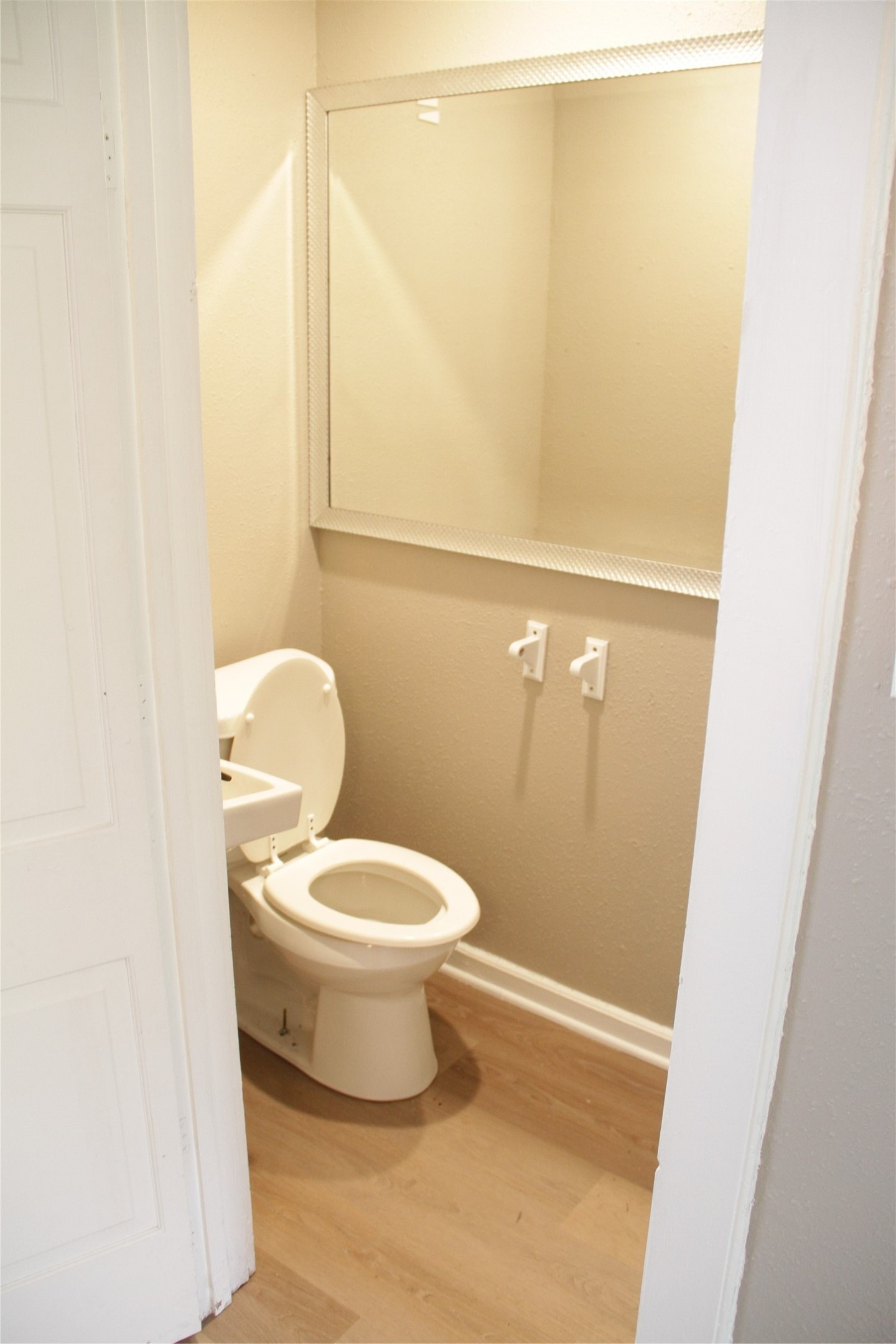 5400 Sheldon Street, Unit B Houston, TX 77008 - Photo 8 of 20 a white toilet sitting next to a shower curtain