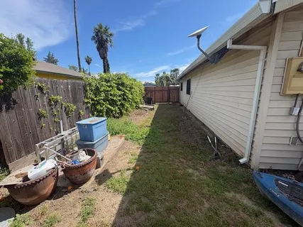 a view of a backyard with sitting area