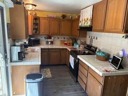 a kitchen with a sink cabinets and appliances
