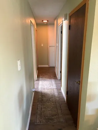 a view of hallway with walk in closet