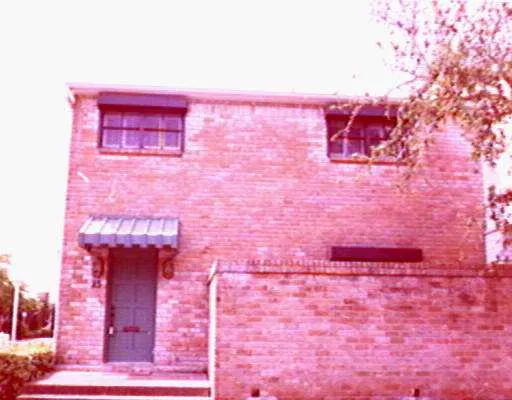 a hallway with pink walls