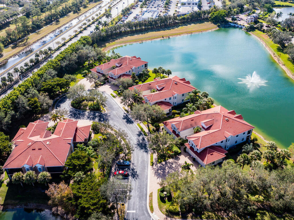 7869 Hawthorne, Unit 303 Naples, FL 34113 - Photo 2 of 52 an aerial view of a houses with a lake
