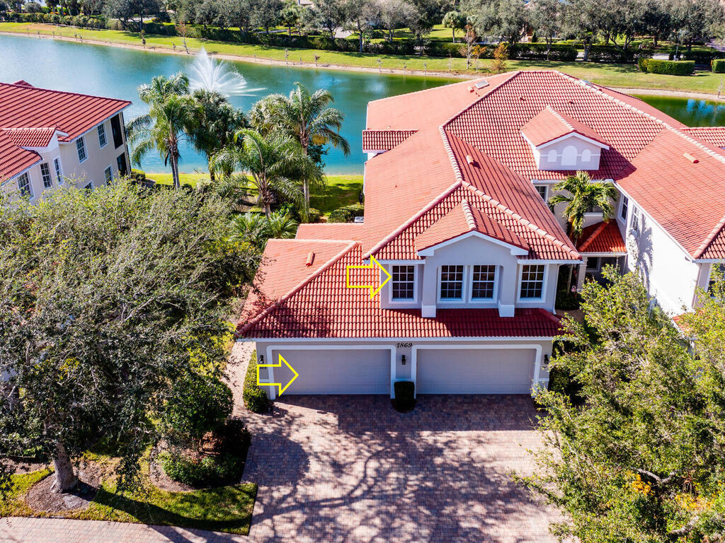 7869 Hawthorne, Unit 303 Naples, FL 34113 - Photo 38 of 52 an aerial view of a house with a lake view
