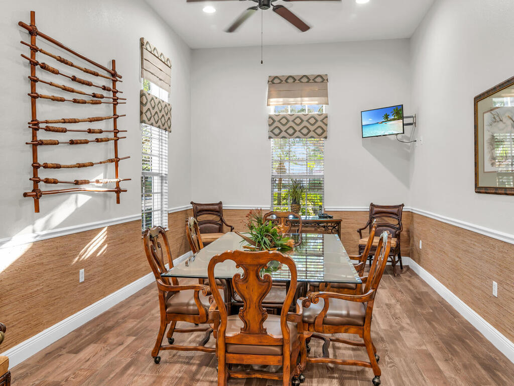 7869 Hawthorne, Unit 303 Naples, FL 34113 - Photo 42 of 52 a view of a dining room with furniture and chandelier