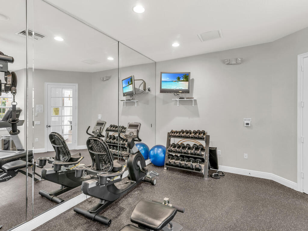 7869 Hawthorne, Unit 303 Naples, FL 34113 - Photo 46 of 52 a view of a room with gym equipment