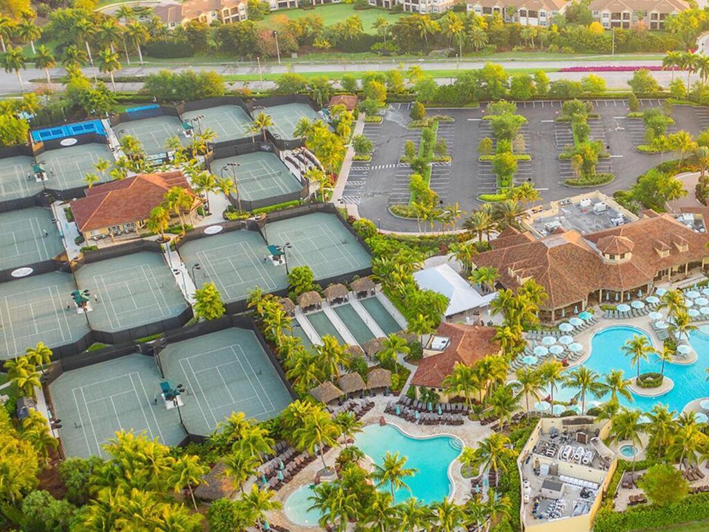 7869 Hawthorne, Unit 303 Naples, FL 34113 - Photo 49 of 52 an aerial view of residential houses with outdoor space and river