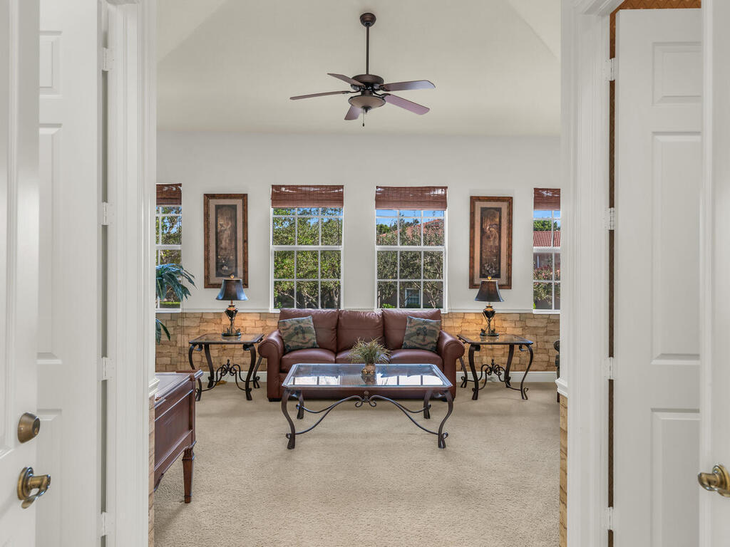7869 Hawthorne, Unit 303 Naples, FL 34113 - Photo 8 of 52 a living room with furniture and a window
