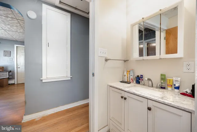 a bathroom with a sink and a mirror