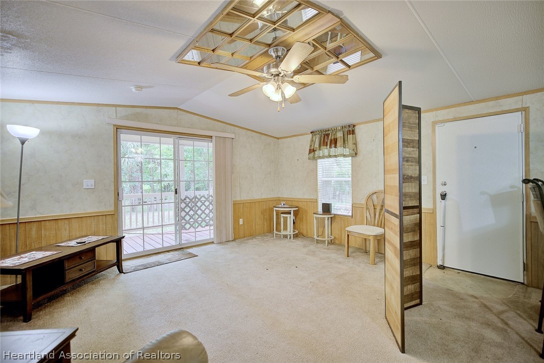 2500 Arbuckle Shrs Road Frostproof, FL 33843 - Photo 14 of 18 a spacious bedroom with a bed and a chandelier
