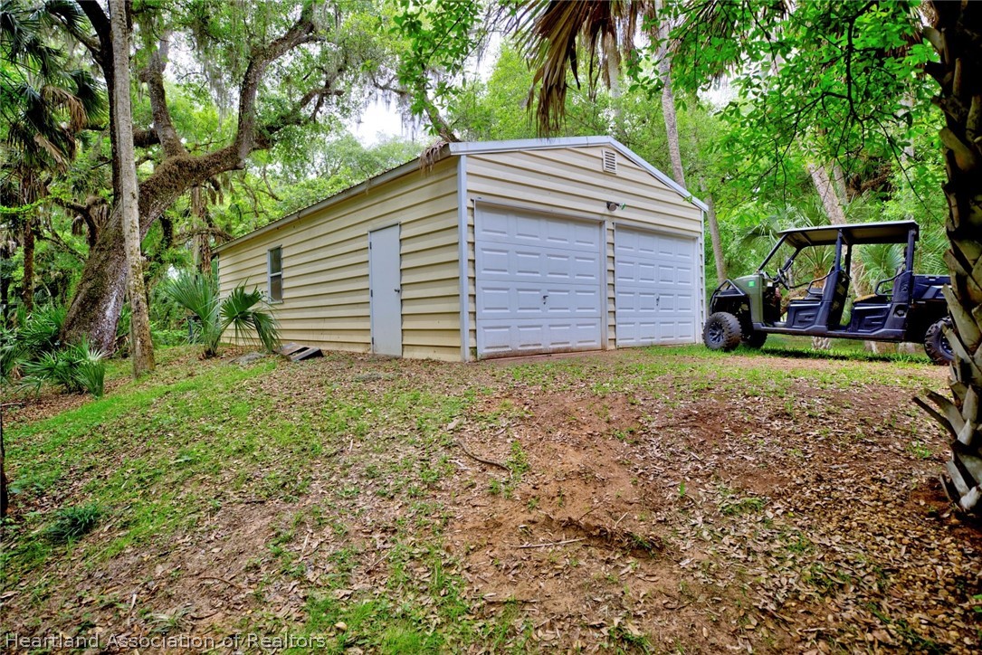 2500 Arbuckle Shrs Road Frostproof, FL 33843 - Photo 18 of 18 a view of a house with a yard
