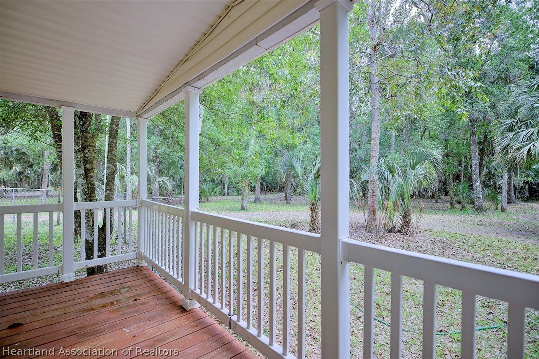 2500 Arbuckle Shrs Road Frostproof, FL 33843 - Photo 4 of 18 a view of a wooden deck next to a yard