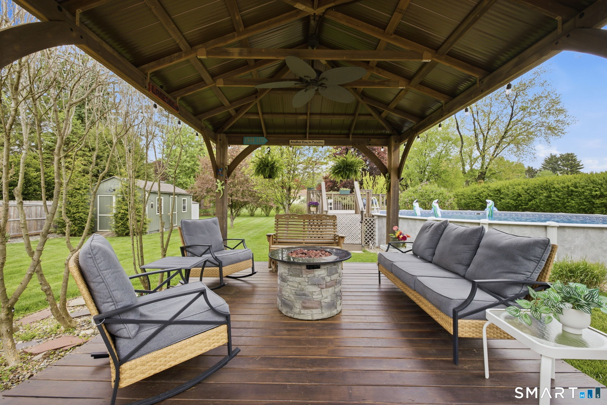 7 Stardust Drive Enfield, CT 06082 - Photo 27 of 38 a view of a chairs and table in patio with a backyard