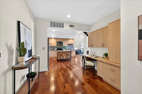 a kitchen with a sink appliances and cabinets