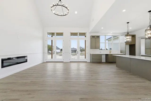 a large kitchen with stainless steel appliances granite countertop a large counter top and a stove